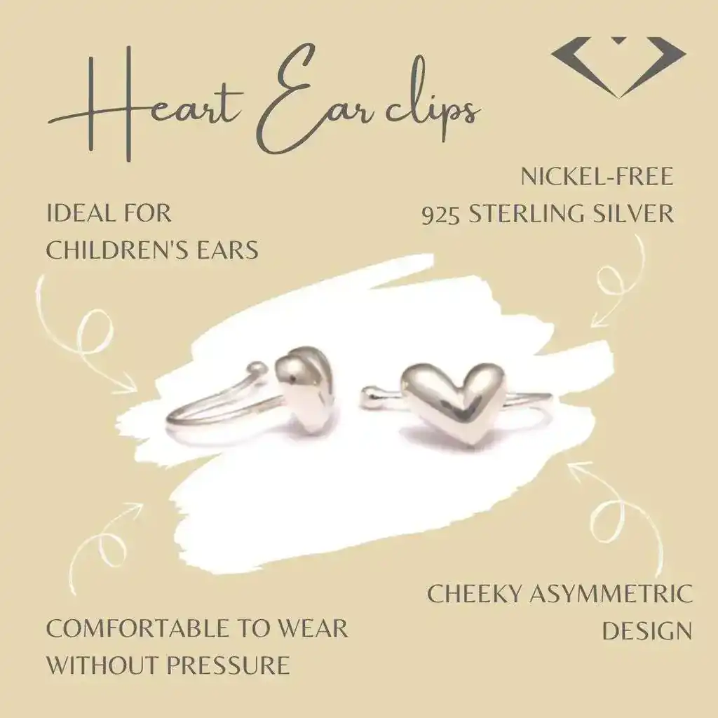 Product image of heart ear clips made from 925 sterling silver. The silver ear clips have an asymmetrical heart design and are nickel-free and pressure-free for comfortable wearing. The background is beige with decorative lettering highlighting the benefits of the product, such as 'Ideal for children's ears' and 'Cheeky asymmetrical design'.
