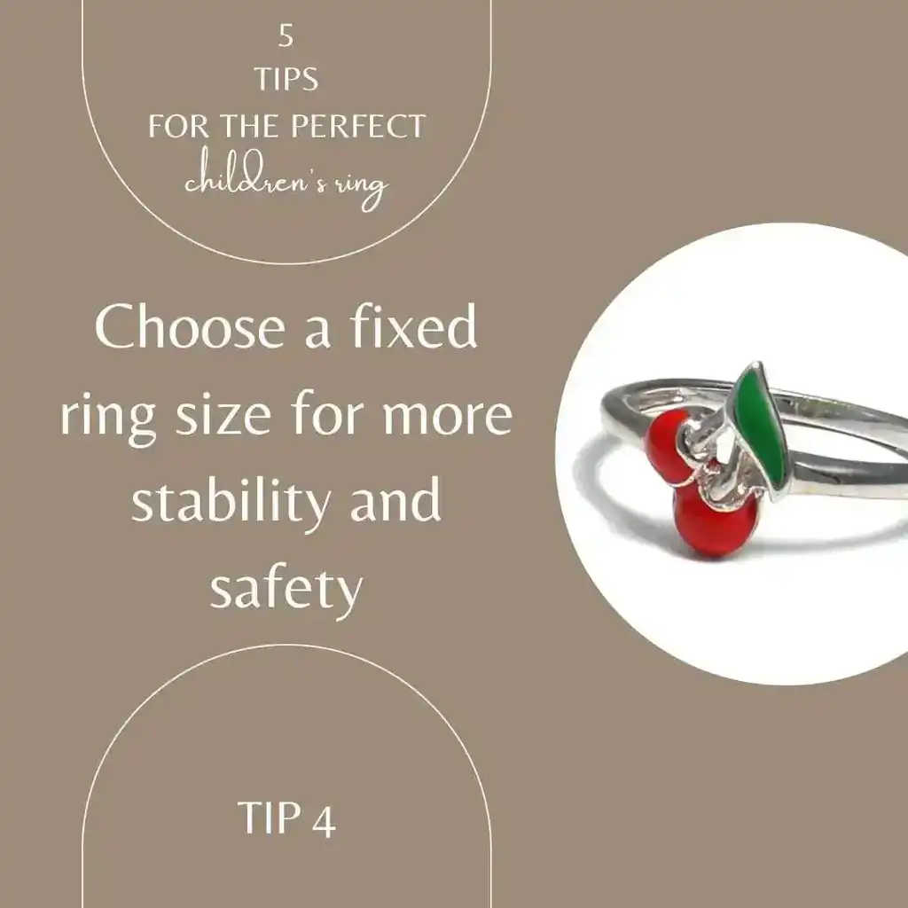 The lettering on the picture shows choose a fixed ring size for more stability and security. The picture itself is beige gold and shows a cherry ring with red and green enamel in 925 Sterling silver. The picture is linked to the children's ring in the store.