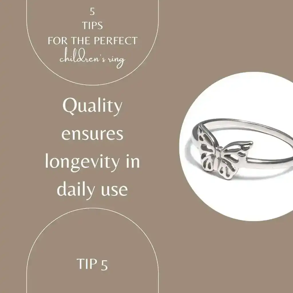The writing on the picture shows quality and ensures longevity in daily use. The picture itself is beige gold and shows a silver butterfly children's ring. The picture is linked to the children's ring in the online store.