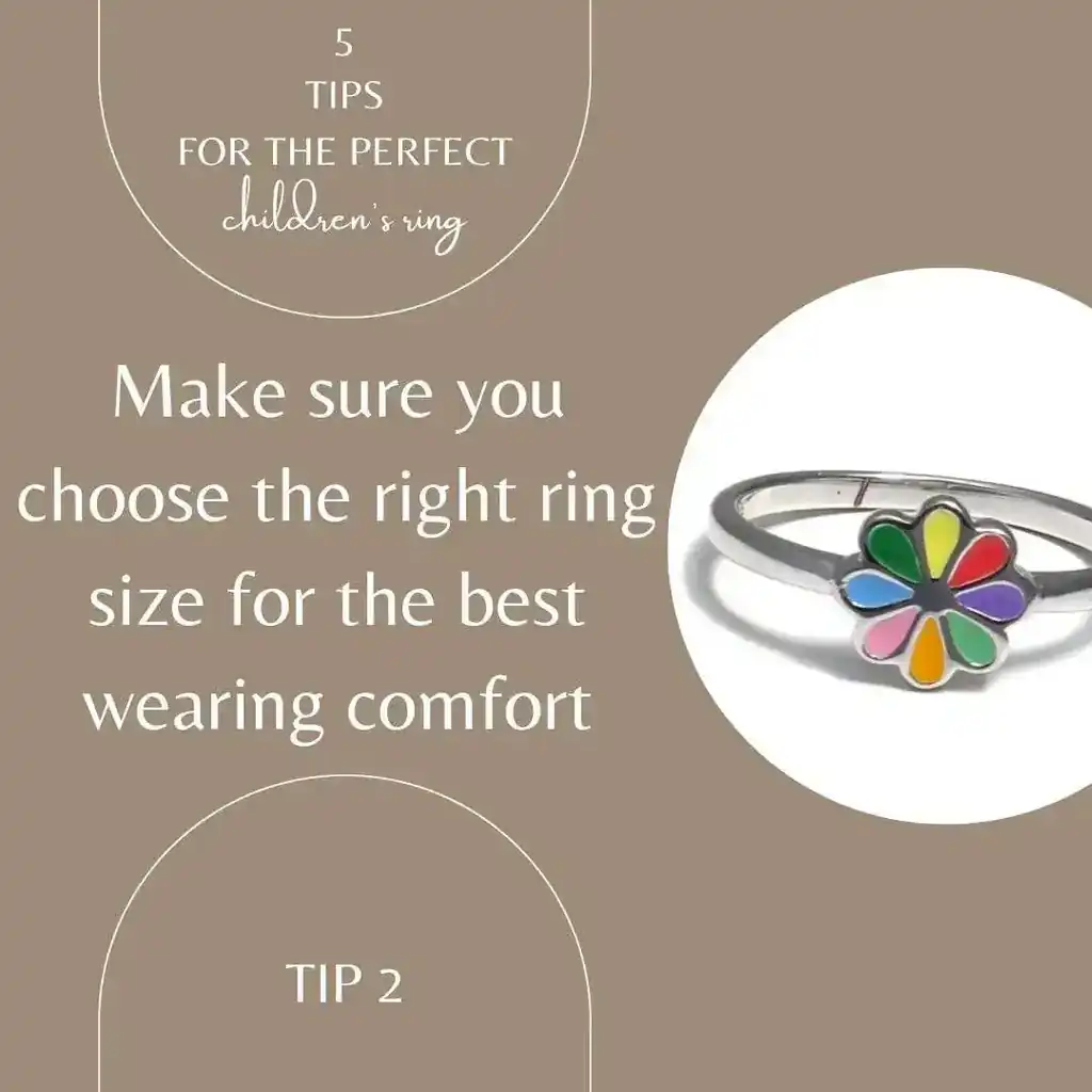 The picture shows the note Pay attention to the correct ring size for best wearing comfort. The picture itself is white and beige and shows a rainbow flower children's ring made of 925 Sterling silver.